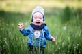 Kid toddler in grass, happy expression Royalty Free Stock Photo