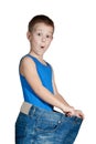 Kid in too big jeans Royalty Free Stock Photo
