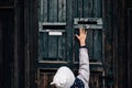 Kid touching on old city doors in Hungary Royalty Free Stock Photo