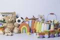 Kid toys collection isolated on blue background. Teddy bear, wooden, plastic and fluffy educational baby toy set. Front Royalty Free Stock Photo