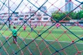 Kid is training soccer football blur background behind the net Royalty Free Stock Photo