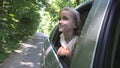 Kid Traveling by Car, Child Face Looking Out the Window, Girl Admiring Nature Royalty Free Stock Photo