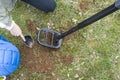 Kid treasure hunters metal detecting and digging the ground Royalty Free Stock Photo