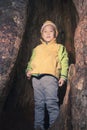 Kid in tree hole