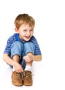 Kid try to tie shoelaces Royalty Free Stock Photo