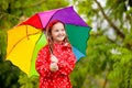 Kid with umbrella playing in summer rain Royalty Free Stock Photo