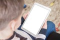Kid use tablet with screen for mockup. Vertical position, close-up