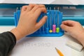 a kid using abacus to calculate addition equation Royalty Free Stock Photo