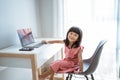 Kid using laptop at home Royalty Free Stock Photo