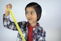 Portrait of young kid measuring height Royalty Free Stock Photo