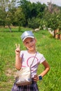 Kid using smartwatch outdoor. Child talking on the smartphone. Schoolgirl using touchscreen on watches browsing internet