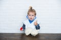 Kid veterinarian doctor with thumbs up gesture diagnose teddy bear Royalty Free Stock Photo