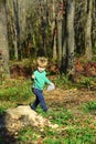 Kid walk in woods. Little kid play on fresh air. Taveler and adventurer