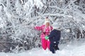 Kid walking and playing in snowy winter forest, winter wonderland, family travel Royalty Free Stock Photo