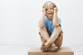 Kid wants attention, feeling alone and upset. Portrait of gloomy unhappy cute boy with blond hair and vitiligo, crying