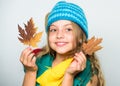 Kid wear warm knitted hat and long scarf. Fall fashion concept. Which fabrics will keep you warmest this autumn. Warm Royalty Free Stock Photo