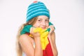 Kid wear warm soft knitted blue hat and long scarf. Warm woolen accessories. Hat and scarf keep warm. Which fabrics will