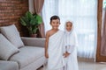 Kid wearing muslim ihram clothes and dress