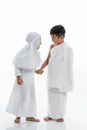 Kid wearing muslim ihram clothes and dress