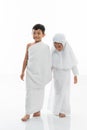 Kid wearing muslim ihram clothes and dress