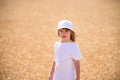 Kid on wheat field in autumn. Child on the rye fields background. Royalty Free Stock Photo