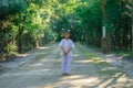 Kid on white clothing , practice walking Meditation in forest tr Royalty Free Stock Photo