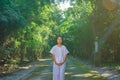 Kid on white clothing , practice walking Meditation in forest tr Royalty Free Stock Photo