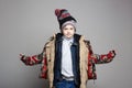 Kid wore all his clothes. Funny Boy in winter outerwear