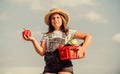 Kid work at farm. Harvest season. Child carry harvest. Buy organic food. Sunny day at farm. Vegetables in basket. Little Royalty Free Stock Photo