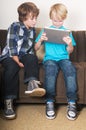 Kid working on a tablet computer Royalty Free Stock Photo