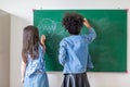 Kid write on chalk board. Back to school. Schoolchild in class. Happy kid writing green blackboard Royalty Free Stock Photo