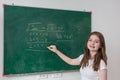 Kid write on chalk board. Back to school. Schoolchild in class. Happy kid writing green blackboard. Royalty Free Stock Photo