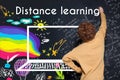 Kid writing on blackboard Distance learning text Royalty Free Stock Photo