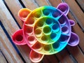 Kid's Rainbow "Pop It" Toy on Old Bamboo Surface Royalty Free Stock Photo