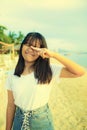 Kidding of asian teenager on summer vacation sea beach Royalty Free Stock Photo