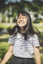 Kidding face of asian teenager showns forelock hair flowing by w Royalty Free Stock Photo