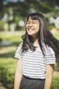 Kidding face of asian teenager showns forelock hair flowing by w Royalty Free Stock Photo