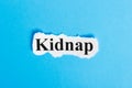 Kidnap text on paper. Word Kidnap on a piece of paper. Concept Image