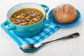 Kidney bean soup in bowl on napkin, bread in saucer Royalty Free Stock Photo