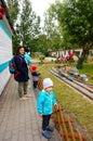 Kids and adults at a miniatur park Royalty Free Stock Photo