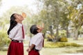 Kids against each other eating indonesian cracker on independence day Royalty Free Stock Photo