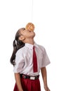 Kids against each other eating indonesian cracker on independence day Royalty Free Stock Photo