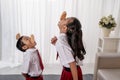 Kids against each other eating indonesian cracker on independence day Royalty Free Stock Photo