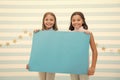 Kids announcement concept. Amazing surprising news. Girl hold announcement banner. Girls kids holding paper banner for