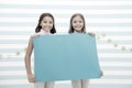 Kids announcement concept. Amazing surprising news. Girl hold announcement banner. Girls kids holding paper banner for