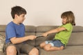 Kids arguing for playing with a digital tablet Royalty Free Stock Photo