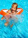 Kids with armbands in swimming pool. Royalty Free Stock Photo