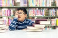 Kids asia boy reading books for education and go to school in library. Royalty Free Stock Photo