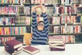 Kids asia boy reading books for education and go to school in library Royalty Free Stock Photo