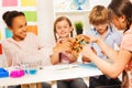 Kids assembling molecule model for science project Royalty Free Stock Photo